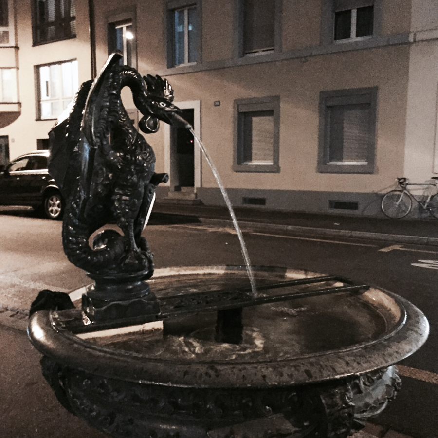 basel basilisk fountain night