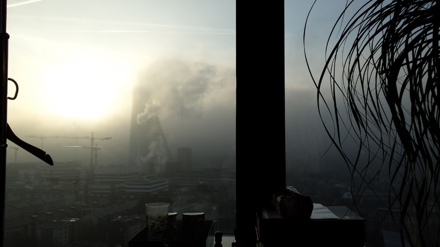 basel city skyscraper messeturm modern view roche tower heavy mist moody creepy