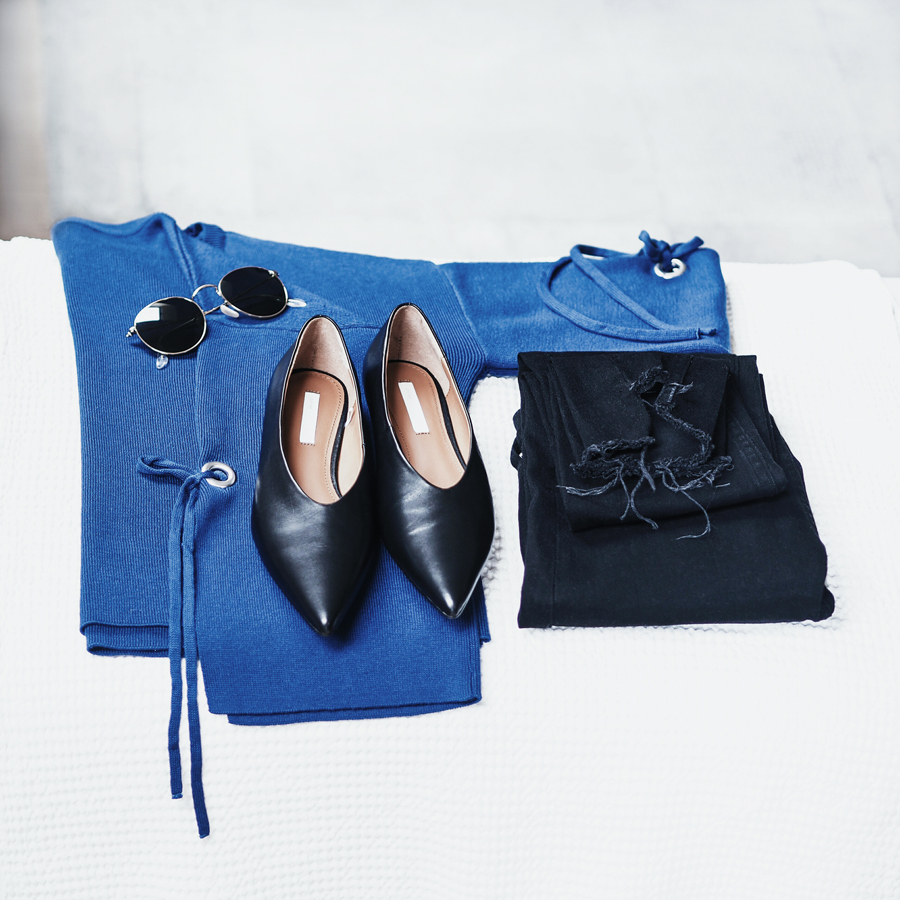 perfect effortless minimal cool workwear outfit look bold blue sleeve eyelet detail jumper raw hem black skinny jeans v-neck premium new season flats ray ban round sunglasses