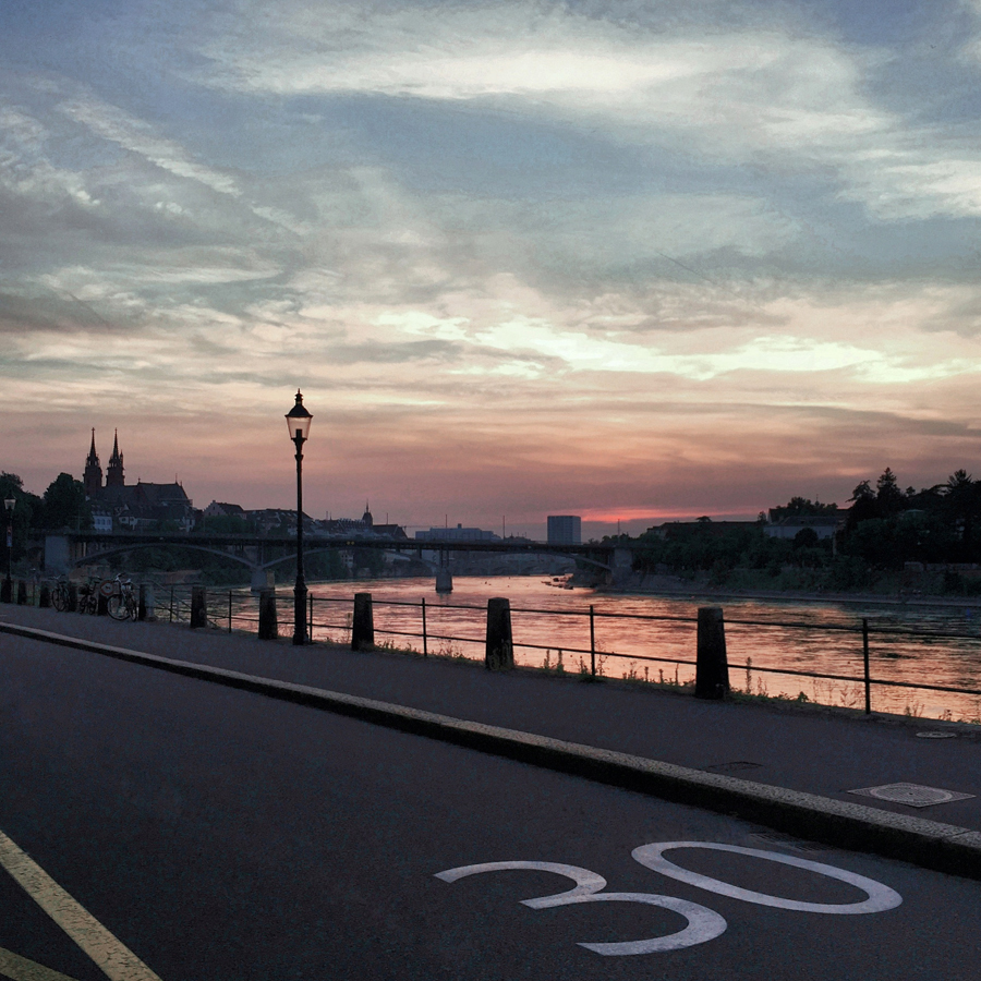 Basel Switzerland riverside sunset city view