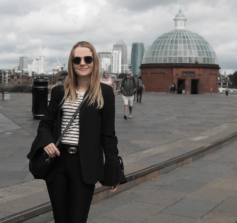 black suit striped tee lace-up bell sleeve blazer cropped trousers loafers mesh socks minimal luxe bag ray-ban