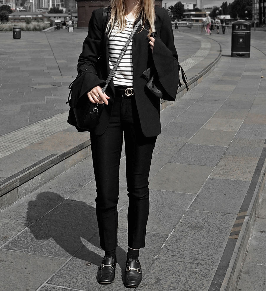 black suit striped tee lace-up bell sleeve blazer cropped trousers loafers mesh socks minimal luxe bag ray-ban
